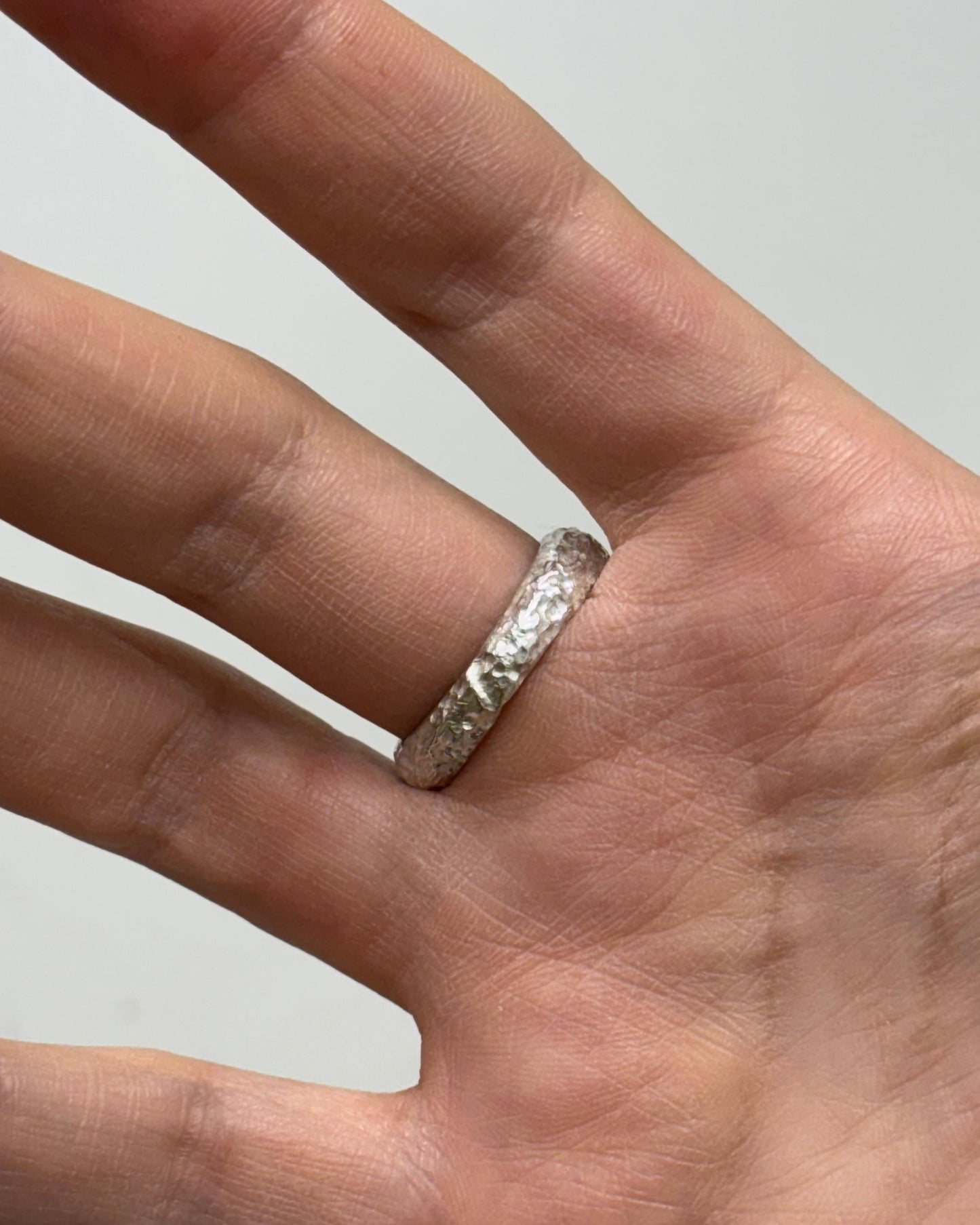 SILVER RING WITH TEXTURE AND BLUE TOPAZ